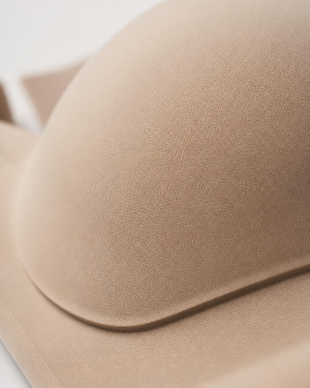 Macro shot of the bonded, seam-free edge on VELRA's Lumen bra in soft taupe